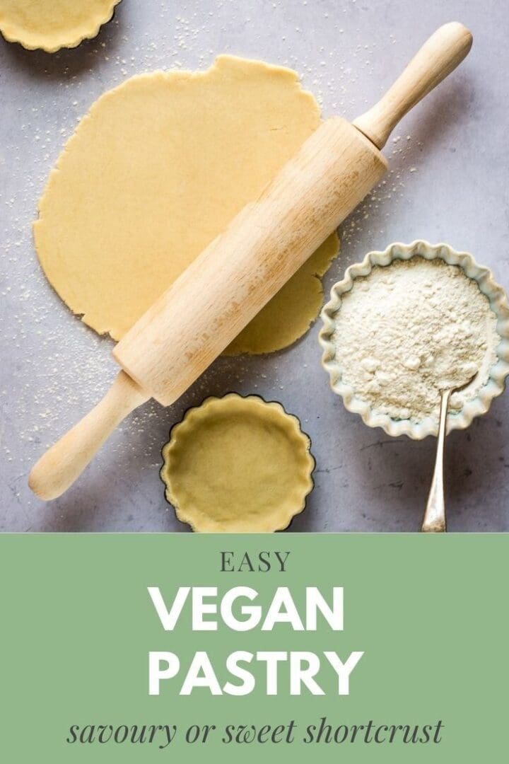 Rolling out vegan pie crust dough with a rolling pin and flour nearby.