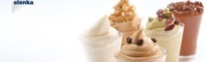 Elenka Cremini's Assorted soft serve ice creams in clear cups are lined up. The flavors appear to include coffee, vanilla, and chocolate, with toppings like nuts, whipped cream, and chocolate shavings. The "elenka" logo is visible in the top left corner.