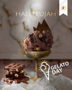 A luxurious chocolate gelato scoop with nuts in a gold cup, topped with a chocolate shard and gold sprinkles. "Hallelujah" text above, and "Gelato Day" with an ice cream cone illustration below. A white and red lion emblem is at the top right.